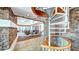 Inviting lobby with a spiral staircase and stone accent wall at 860 Peachtree Ne St # 917, Atlanta, GA 30308