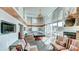 Relaxing lounge with fireplace, billiards table, and comfortable seating with city views through large windows at 860 Peachtree Ne St # 917, Atlanta, GA 30308