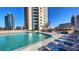 Beautiful rooftop pool with lounge chairs and city views at 860 Peachtree Ne St # 917, Atlanta, GA 30308