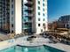 Luxury apartment featuring a rooftop pool deck with lounge chairs, providing a refreshing and relaxing experience at 860 Peachtree Ne St # 917, Atlanta, GA 30308