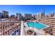 Wide angle view of the rooftop pool with city skyline at 860 Peachtree Ne St # 917, Atlanta, GA 30308