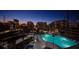 Night aerial of luxury apartments showcasing a stunning rooftop pool, perfect for evening relaxation and city views at 860 Peachtree Ne St # 917, Atlanta, GA 30308