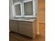 Primary bath featuring dual sinks with granite counters and backlit mirrors at 903 Jackson Oak Place, Villa Rica, GA 30180