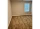 Neutral bedroom with a bright window offering ample natural light, showcasing a cozy atmosphere at 903 Jackson Oak Place, Villa Rica, GA 30180