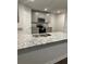 Kitchen island with a stainless steel sink and granite countertop at 903 Jackson Oak Place, Villa Rica, GA 30180