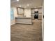 Eat-in kitchen with grey cabinets, stainless steel appliances, and granite countertops at 903 Jackson Oak Place, Villa Rica, GA 30180