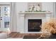 Living room with a white fireplace, neutral decor, and glass doors with lots of light at 1589 Mims Sw St, Atlanta, GA 30314