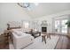 Bright living room features a fireplace, high ceilings, and an open layout with wood floors at 1589 Mims Sw St, Atlanta, GA 30314