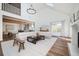 Open-concept living room with wood floors, fireplace, and a smooth transition to the kitchen area at 1589 Mims Sw St, Atlanta, GA 30314