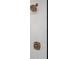 Detailed view of bronze shower fixtures and tile work at 1589 Mims Sw St, Atlanta, GA 30314