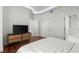 Bedroom with hardwood floors, king bed, closet doors and ensuite bathroom access at 2828 Peachtree Nw Rd # 701, Atlanta, GA 30305