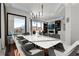 Elegant dining room with stylish table set for eight and stunning views at 2828 Peachtree Nw Rd # 701, Atlanta, GA 30305