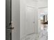 Bright hallway features white marble floors leading to the living room at 2828 Peachtree Nw Rd # 701, Atlanta, GA 30305