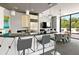 Contemporary kitchen with modern appliances, bar seating, and natural light at 2828 Peachtree Nw Rd # 701, Atlanta, GA 30305