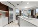 Bright kitchen features white cabinets, stainless steel appliances, and marble countertops at 2828 Peachtree Nw Rd # 701, Atlanta, GA 30305