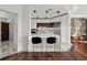 Modern kitchen with stainless steel appliances, white cabinets, breakfast bar, and black bar stools at 2828 Peachtree Nw Rd # 701, Atlanta, GA 30305