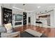 Cozy living room with marble accent wall, fireplace, and open kitchen at 2828 Peachtree Nw Rd # 701, Atlanta, GA 30305