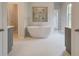 Luxurious bathroom featuring a freestanding tub, separate vanities, and a spacious walk-in shower at 31 Homesite Cooper E Cv, Fayetteville, GA 30214