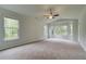 Spacious bedroom with large windows offering views of the surrounding trees, carpeted flooring at 31 Homesite Cooper E Cv, Fayetteville, GA 30214