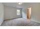 A bedroom with carpeted floors, a window, and closet at 31 Homesite Cooper E Cv, Fayetteville, GA 30214