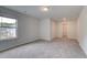 A bedroom with carpeted floors, a window, and closet at 31 Homesite Cooper E Cv, Fayetteville, GA 30214