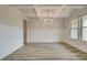 Elegant dining room with coffered ceilings, wainscoting, hardwood floors and large windows at 31 Homesite Cooper E Cv, Fayetteville, GA 30214