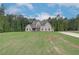 Stunning two-story home with a manicured lawn and lush surrounding greenery, radiating curb appeal at 31 Homesite Cooper E Cv, Fayetteville, GA 30214