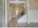 Inviting foyer with hardwood flooring, a staircase with iron railings, and a view into the living space at 31 Homesite Cooper E Cv, Fayetteville, GA 30214
