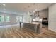Kitchen with an island, pendant lighting, and stainless steel appliances at 31 Homesite Cooper E Cv, Fayetteville, GA 30214