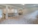 An upstairs loft with carpet flooring and decorative wrought iron handrail at 31 Homesite Cooper E Cv, Fayetteville, GA 30214
