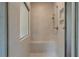 Bright tiled shower with a built-in bench, and a shower head at 31 Homesite Cooper E Cv, Fayetteville, GA 30214