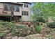 Lush backyard with stone details, and a spacious lawn area at 2819 Saddlebrook Nw Way, Marietta, GA 30064