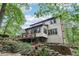 Sprawling backyard view with a deck and mature trees at 2819 Saddlebrook Nw Way, Marietta, GA 30064