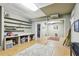 Versatile basement space with built-in shelving and bright lighting at 2819 Saddlebrook Nw Way, Marietta, GA 30064