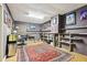 Cozy basement space with a desk, shelving, and overhead lighting at 2819 Saddlebrook Nw Way, Marietta, GA 30064