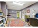 Basement office with built-in shelving, storage, and laminate wood flooring at 2819 Saddlebrook Nw Way, Marietta, GA 30064