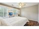 Bedroom featuring built-in shelving, hardwood floors, and two windows at 2819 Saddlebrook Nw Way, Marietta, GA 30064
