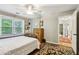 Bedroom with a four-poster bed, hardwood floors, and a built-in desk at 2819 Saddlebrook Nw Way, Marietta, GA 30064