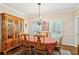 Traditional dining room with hardwood floors, a chandelier, and a wooden china cabinet, perfect for entertaining at 2819 Saddlebrook Nw Way, Marietta, GA 30064