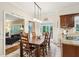 Open dining area with wooden table, chairs, and a granite-counter kitchen view, creating a casual dining experience at 2819 Saddlebrook Nw Way, Marietta, GA 30064