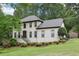 Charming two-story home with a well-manicured lawn and lush landscaping creating a welcoming curb appeal at 2819 Saddlebrook Nw Way, Marietta, GA 30064