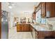 Spacious kitchen featuring granite countertops, stainless steel appliances, and dark wood cabinetry at 2819 Saddlebrook Nw Way, Marietta, GA 30064