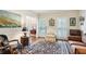 Bright living room with hardwood floors, plantation shutters, and comfortable seating, offering a relaxing atmosphere at 2819 Saddlebrook Nw Way, Marietta, GA 30064