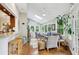 Inviting sunroom offering bright windows and a view to the kitchen at 2819 Saddlebrook Nw Way, Marietta, GA 30064