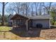 Exterior of home shows screened-in porch and a well maintained backyard at 3594 Vinyard Way, Lawrenceville, GA 30044