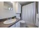 Clean bathroom with shower curtain and tiled floors at 3594 Vinyard Way, Lawrenceville, GA 30044