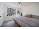 Relaxing bedroom featuring a large window, plants, and light-colored walls at 3594 Vinyard Way, Lawrenceville, GA 30044