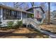 Inviting two-story home with a charming front porch, trimmed windows, and well-kept landscaping at 3594 Vinyard Way, Lawrenceville, GA 30044