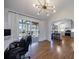 Bright home office space that overlooks the kitchen with hardwood floors and modern lighting at 3594 Vinyard Way, Lawrenceville, GA 30044