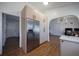 Kitchen area featuring wood floors and stainless steel fridge at 3594 Vinyard Way, Lawrenceville, GA 30044
